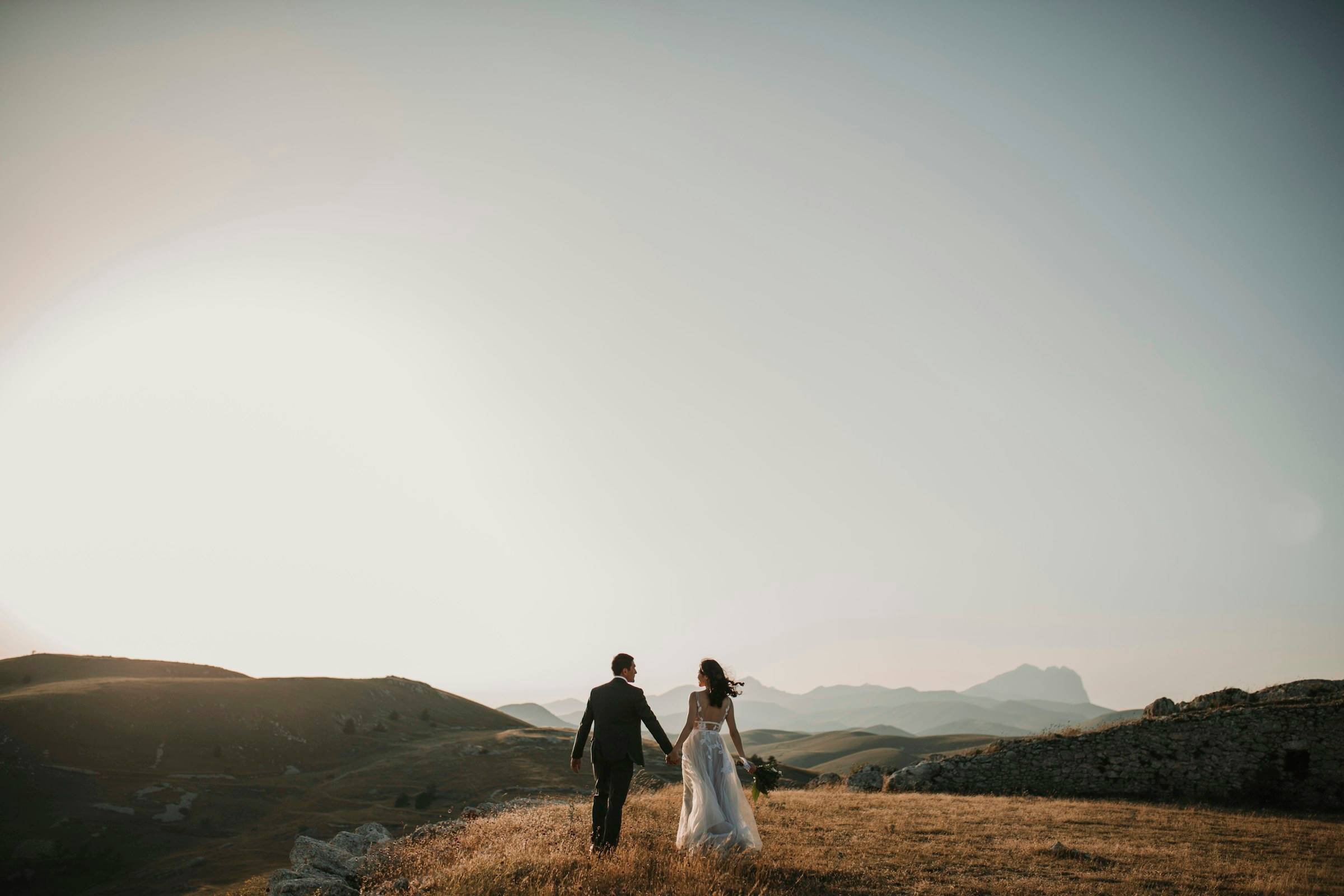 A bride and groom walking together after their ceremony