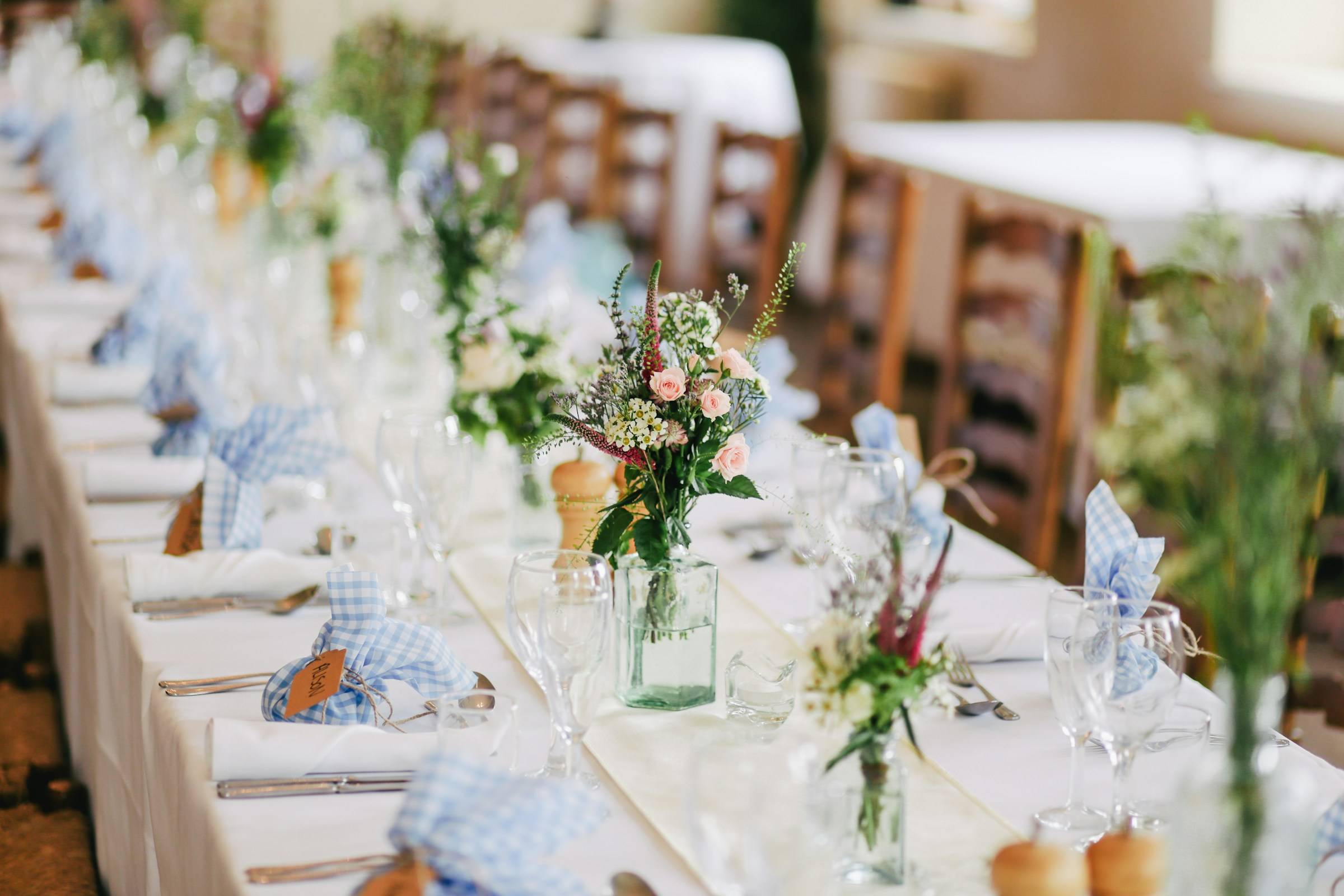Glasses set out on the tables before the wedding breakfast